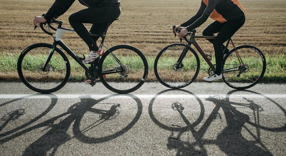 Two people cycling